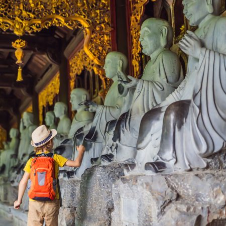 Boy Tourist In Temple Tower Of Bai Dinh Pagoda In Ninh Binh, Vietnam. Resumption Of Tourism In Vietnam After Quarantine Coronovirus Covid 19